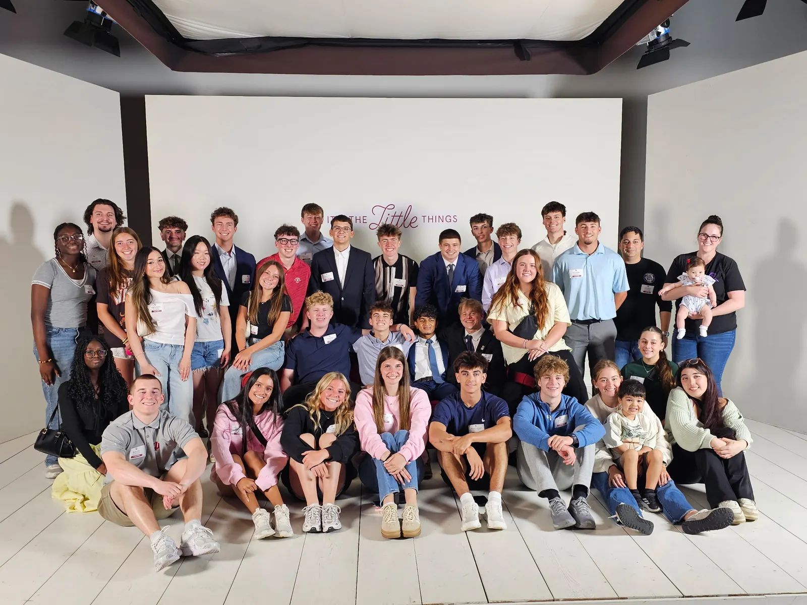 The Brownsburg DECA chapter together for a group photo in a studio
